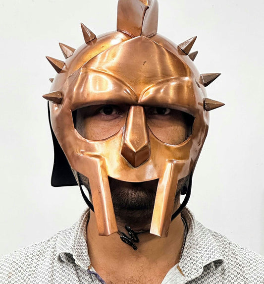 a man wearing a helmet with spikes on it