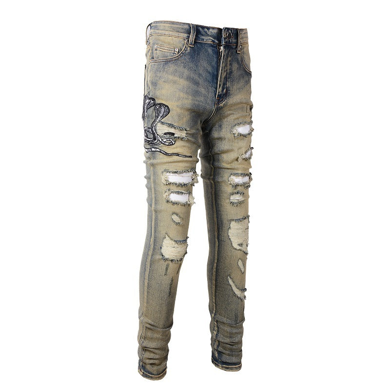 Three Headed Snake Embroidery With Torn Holes, Patchwork Leather, Distressed Stretch Slim Fitting Light Colored Jeans